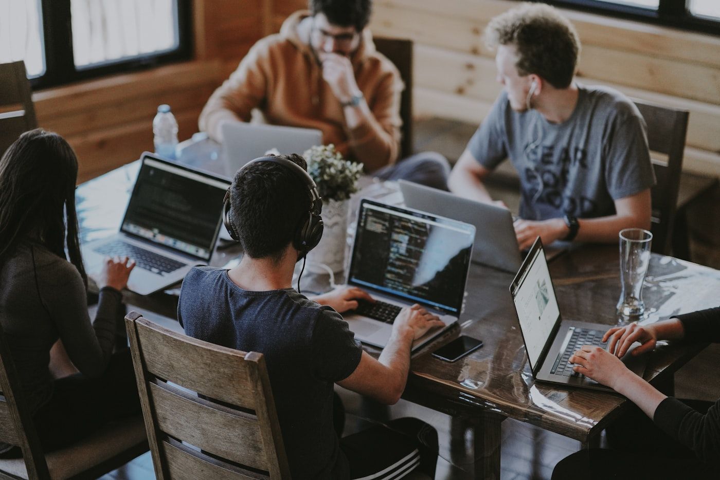 A small team working together across laptops